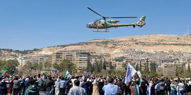 Syrian Arab Army Air Force participates in the 14th anniversary celebrations of the Syrian revolution.